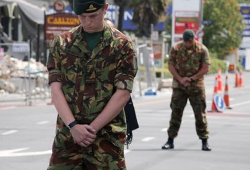 Soldiers observe the two minutes' silence in Christchurch. Photo: TV3
