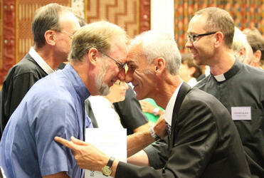The hongi line - and The Rev Tom Poata (Vicar of St Faith's, Ohinemutu) greets the Rev Dr Derek Tovey.