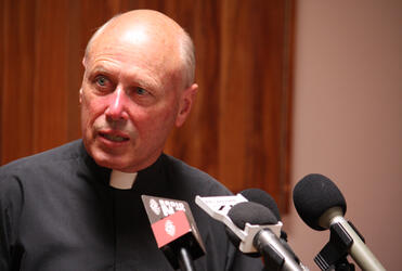 Archdeacon Robin Kingston, who is organising Thursday's remembrance service, conducts a press conference.