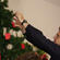 Tim Mora decorates the tree at Cobden's Church of the Resurrection. The angels recall the ones who won't be home for Christmas.