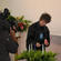 Under the scrutiny of the TV cameras, young Joshua Copp lights the first Advent candle at the Cobden Church.