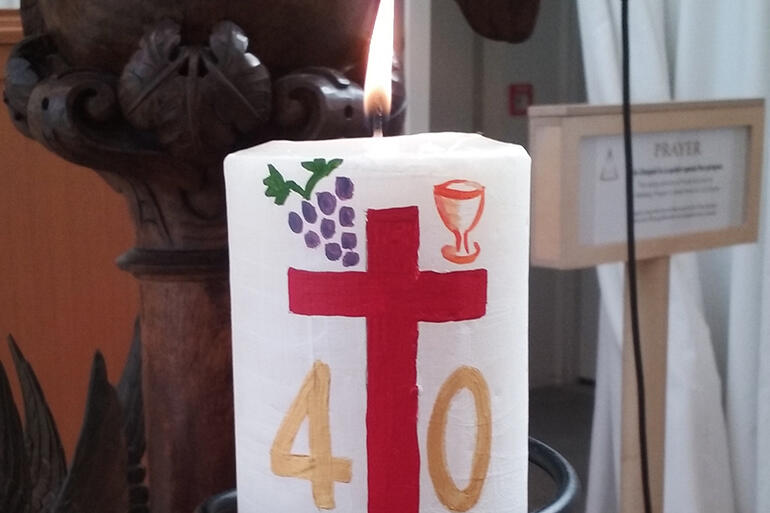 Close-up of a 40th anniversary candle made for the Transitional Cathedral by Elizabeth Kimberley. Close-up of a 40th anniversary candle made for the Transitional Cathedral by Elizabeth Kimberley.