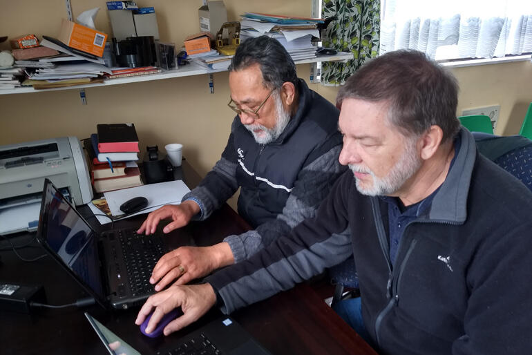 Lead Translator Ioane Teao and NZ Bible Society Translations Director Dr Stephen Pattemore check the final Tokelauan Bible translation. Lead Translator Ioane Teao and NZ Bible Society Translations Director Dr Stephen Pattemore check the final Tokelauan Bible translation.