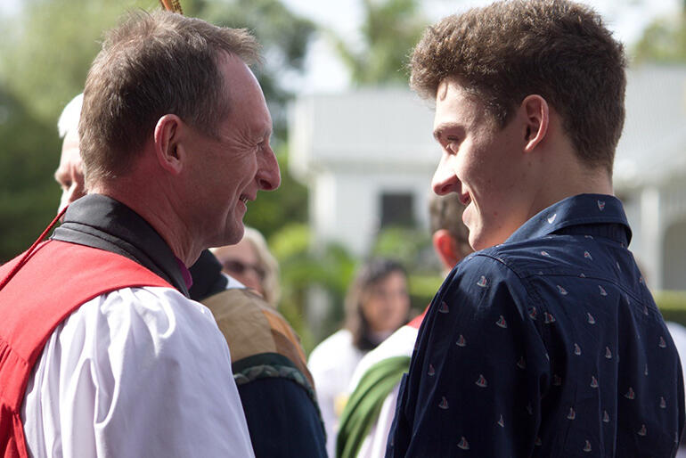 Bishop Ross Bay shares a chuckle with Adam Kelly-Moore.
