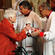 Bishop Rahu Katene administers the cup of blessing during the Synod Eucharist.