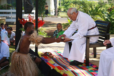Archbishop Brown takes the kava.