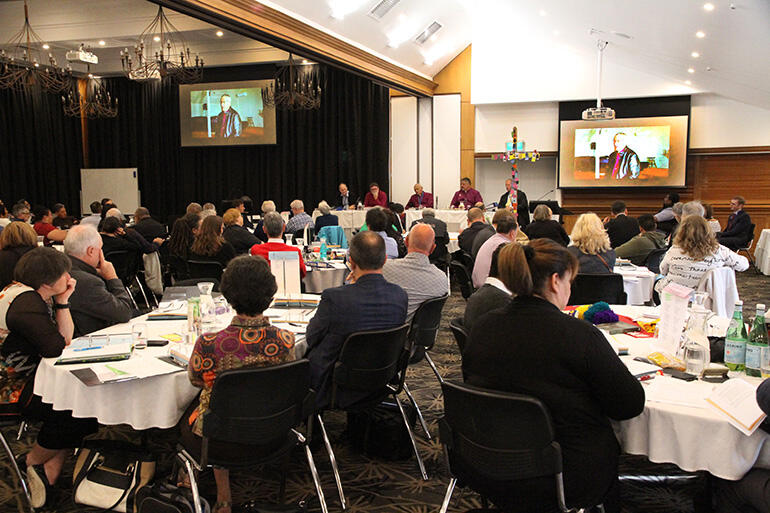 Synod listens to the video report from Bishop Richard Ellena.