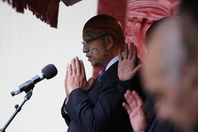 Ringatu leader Te Kahauta Maxwell prays from the paepae.