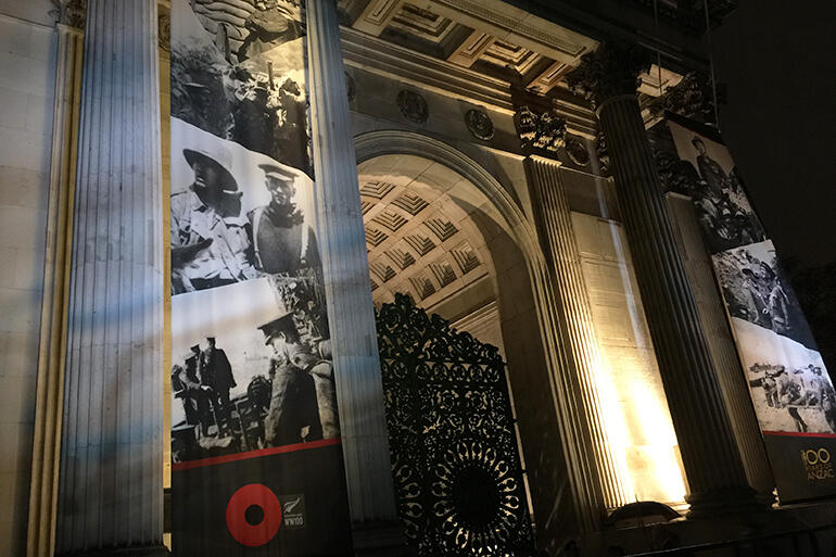 3am in Hyde Park in London on Anzac Day 2015 - and images of ANZAC soldiers are projected against The Wellington Arch.