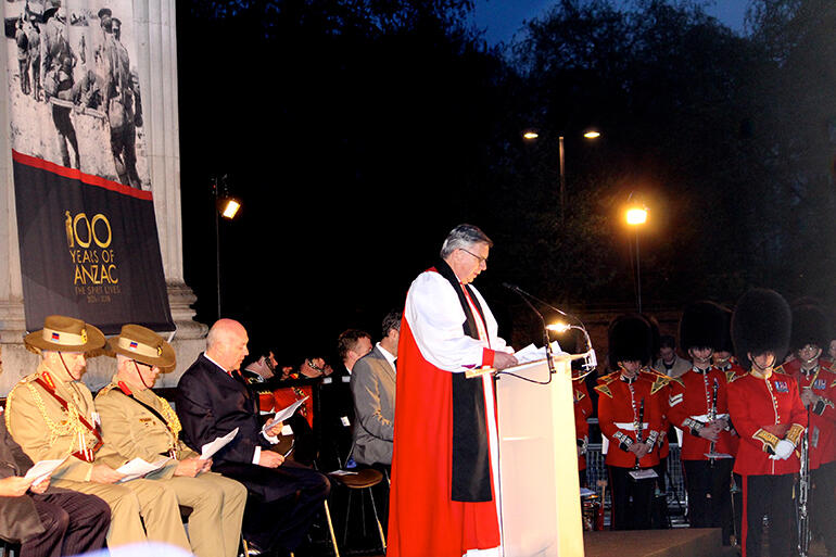 Archbishop Sir David Moxon leading the dawn service before The Wellington Arch in Hyde Park.