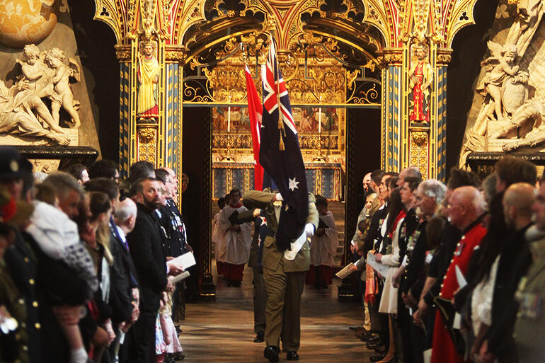 Honour for sacrifices past, hope for the future: the flags of New Zealand, Turkey, the UK and Australia being brought into Westminster Abbey.