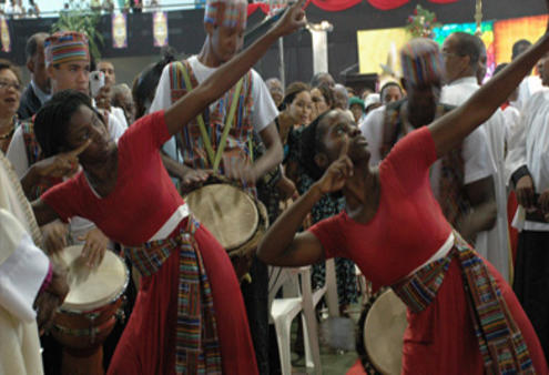 Dancers and drummers welcome the altar party for the ACC's opening Eucharist in Kingston, Jamaica.