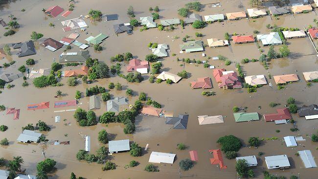 Homes in the city of Ipswich, west of Brisbane, are inundated by floodwaters. Picture: AAP
