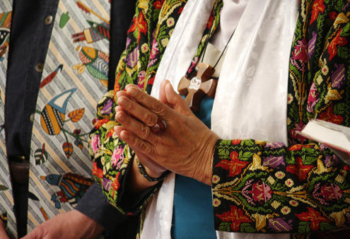 Taimalelagi Tuatagaloa, who chaired the consultation, celebrates the Eucharist. Note the stole of the Australian priest next to her