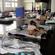 Flood victims doss down in a Brisbane evacuation centre.