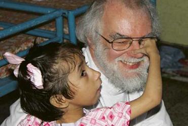 Dr Williams with one of the children at the Shishu Bhavan orphanage, next to the Mother House in Kolkata.
