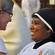 Dr Eeva John, Academic Register of Trinity College, Bristol, congratulates St Veronica - who is studying at Trinity College.