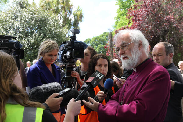 Archbishop Rowan faces the press during his tour of Christchurch's Red Zone.