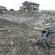 A wheelchair sits forlorn amid the desolation of a town in northern Japan.