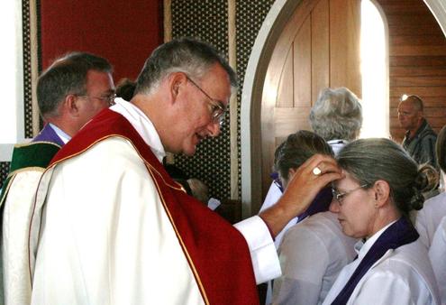 Archbishop Philip Aspinal anoints Canon Deborah Broome at Rangiatea in 2008, during the Wellington diocese 150th celebrations.