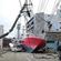 A boat is dumped in a street of Hishonomaki, Miyagi, after being swept inshore by the tsunami. Photo: AFP/Getty