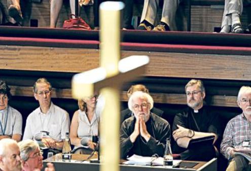 Dr Rowan Williams listens soberly as the debate swings in favour of women bishops at the Church of of England General Synod.