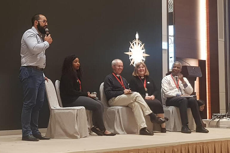 Isaac Beach speaks to ACC17 with panel L-R: Basetsana Makena, Archbishop Justin Welby, Bishop Jane Alexander and Archbishop Thabo Makgoba. Isaac Beach speaks to ACC17 with panel L-R: Basetsana Makena, Archbishop Justin Welby, Bishop Jane Alexander and Archbishop Thabo Makgoba.