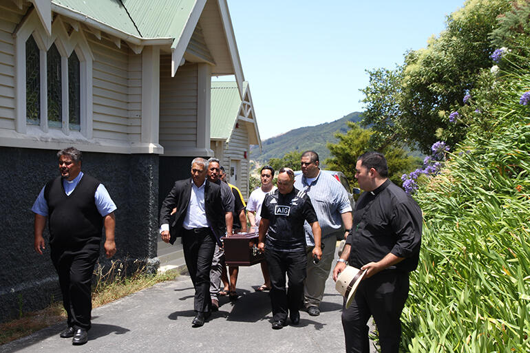 The pallbearers take Archbishop Brown from St Mary's. The pallbearers take Archbishop Brown from St Mary's.