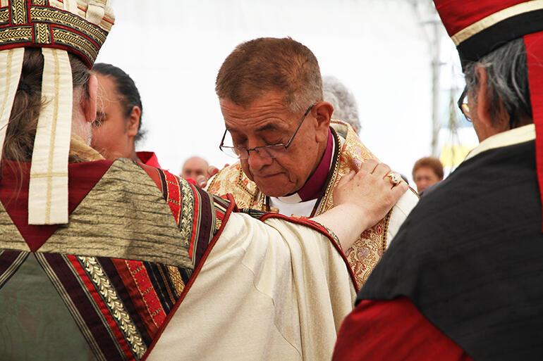 An emotional moment: Bishop Mark McDonald, Canada's National Indigenous Bishop, lays hands on Bishop John Gray, the new AIN Secretary General.