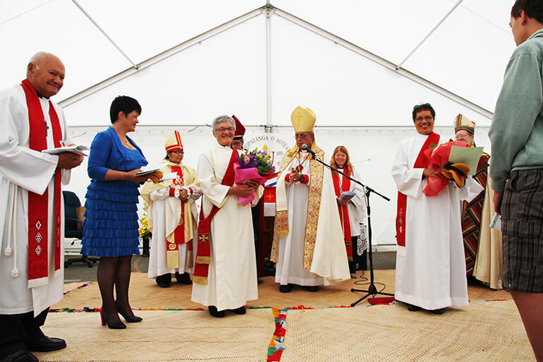 Ramiri Joseph (with the bouquet, at left) and Tapita Ching (bouquet, at right) were ordained to the diaconate.