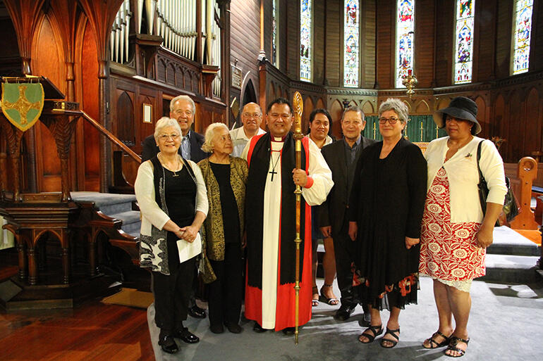 Bishop Pikaahu with Te Take ki Oihi. That's Dame Georgine Kirby standing alongside him in the green jacket.