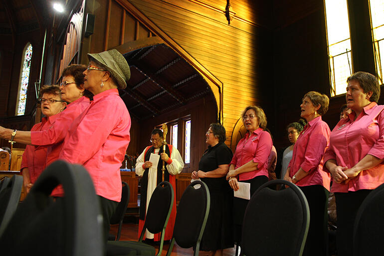 Crozier in hand, the Bishop supports the Auckland Anglican Maori Cub in their waiata.