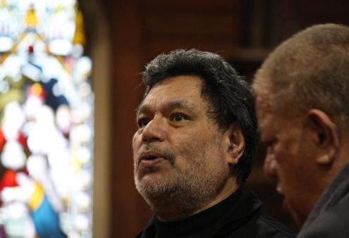 Turi Hollis leads a waiata in support of his Bishop, John Gray's contribution.