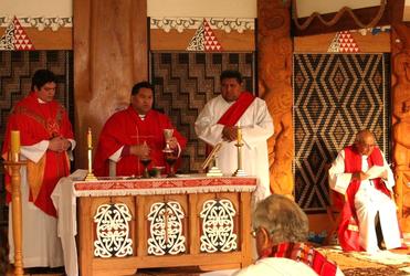 A newly priested Michael Tamihere at the Great Thanksgiving with Bishop Kito and Tapu Laulu.