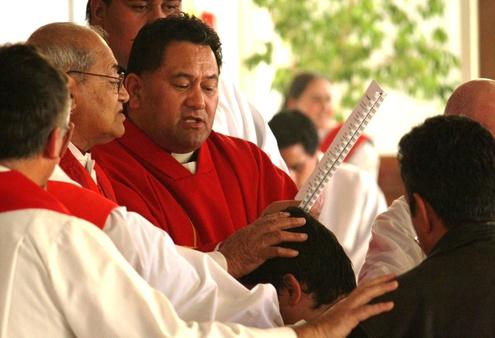 Archbishop Brown Turei and Bishop Kito Pikaahu ordain Michael Tamihere to the priesthood.