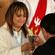 Hayley Mitchell, Manu Karakia, offers the chalice to Catherine Teller, Michael Tamihere's mother.