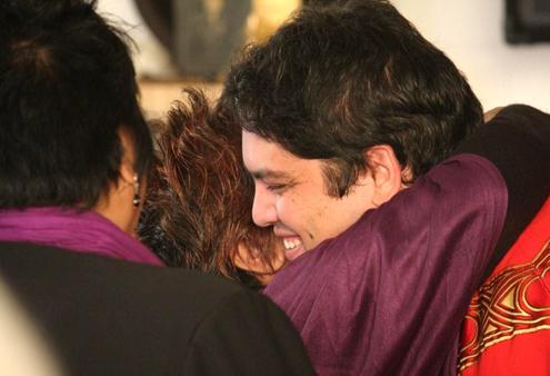 The Rev Michael Tamihere is embraced by a well-wisher.