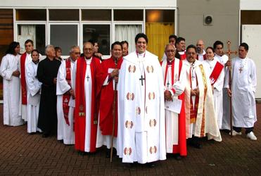The Rev Michael Tamihere, priest, and some of his supporters.