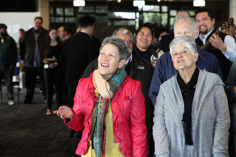 Giving thanks at the final Eucharist: that's the Rev Canon Numia Tomoana in the pink jacket, and the Rev Canon Marie McDonald.