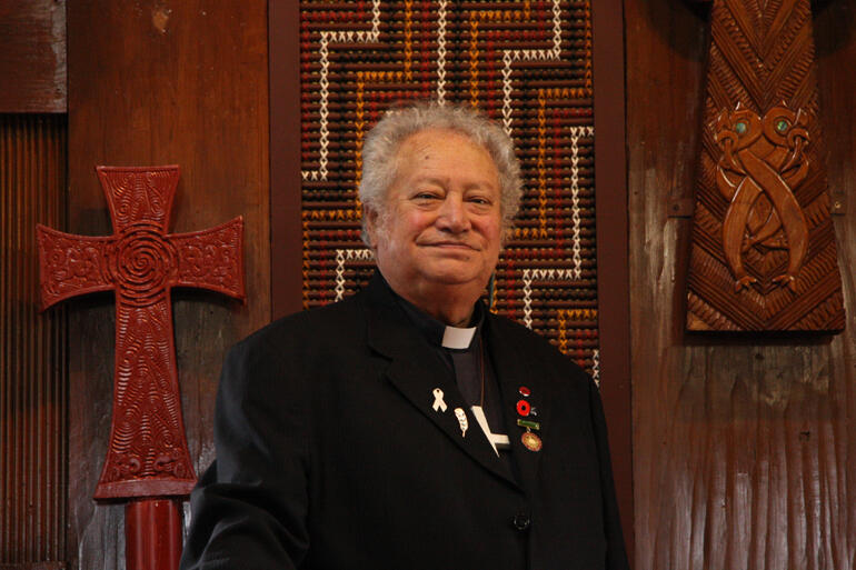 The Ven Richard Wallace stands at the altar in the chapel of Te Waipounamu diocesan centre in Otautahi.