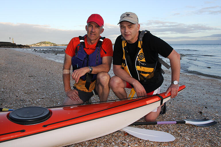 John Tuke and Bishop Jim White pause before beginning their marathon paddle from Mission Bay to Oihi Beach.