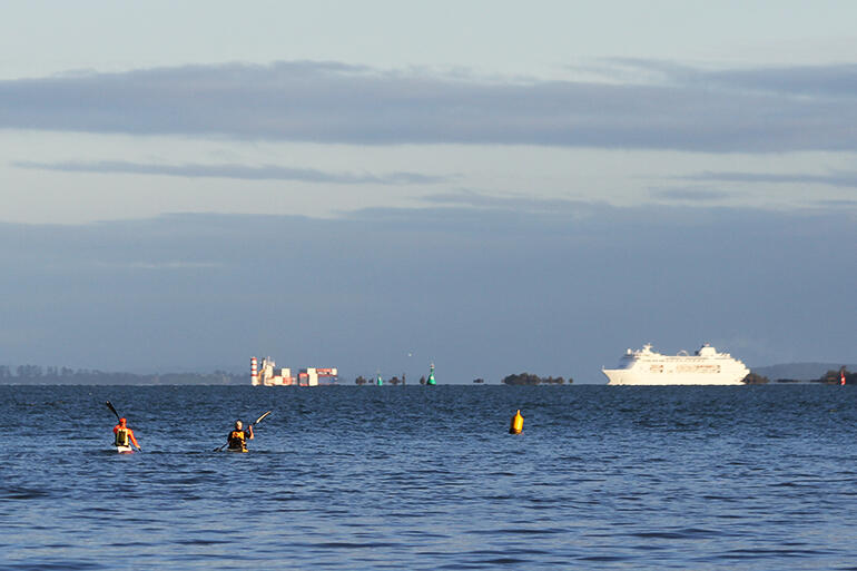 Who gives way to whom? The cruise liner emerging from behind Rangitoto Island, bound for the Port of Auckland.