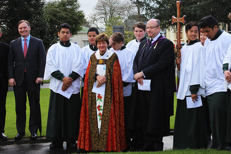 Rev Anne Mills, outside St Mark's Remuera. The Principal of Dilworth School, Mr Donald MacLean, is standing beside her.