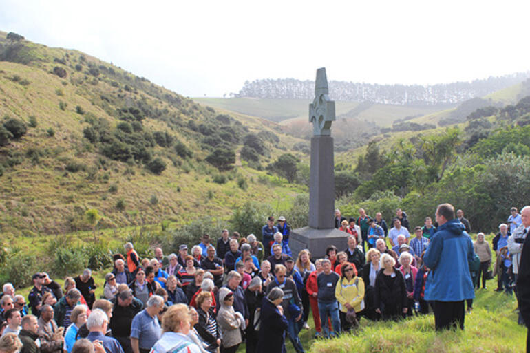 Gathering at the foot of the Marsden Cross.