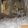 Rubble fills the nave of ChristChurch Cathedral. The pulpit has been partially destroyed.