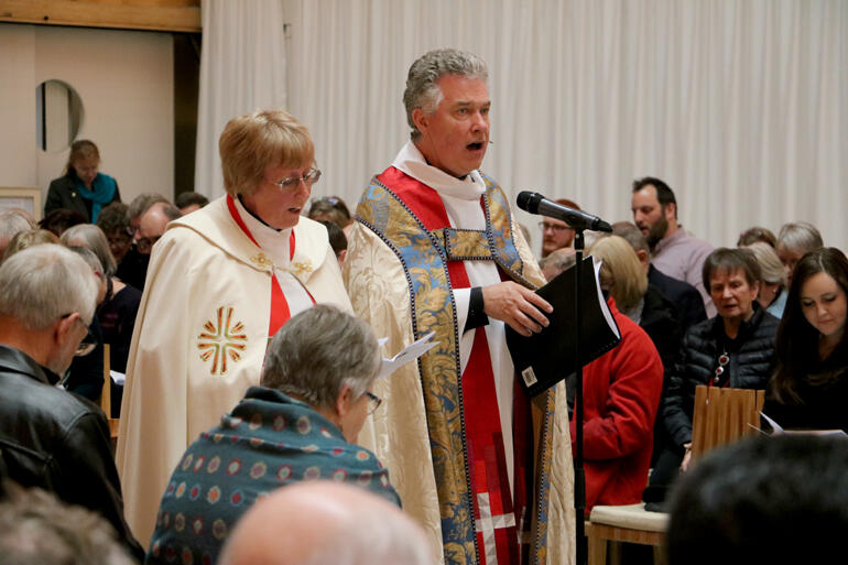 Vicar-General Ven Canon Helen Roud and Dean Lawrence Kimberley lead prayers of the people.