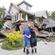 Murray and Kelly James survey the damage to their house in central Christchurch. Photo: AP.