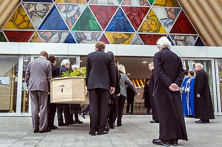 Dean Lynda Patterson's casket is taken into the Transitional Cathedral. Photo: John Kirk-Anderson/Fairfax NZ