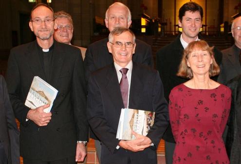 Chris Honore and Allan Davidson holding their copies of Living Legacy, the new Auckland diocesan history.