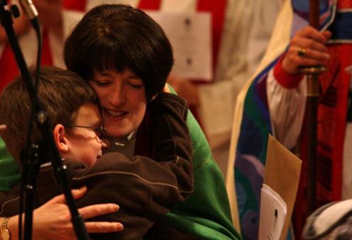 Nathan Kelly-Moore gives his newly-installed mum a squeeze of congratulations.